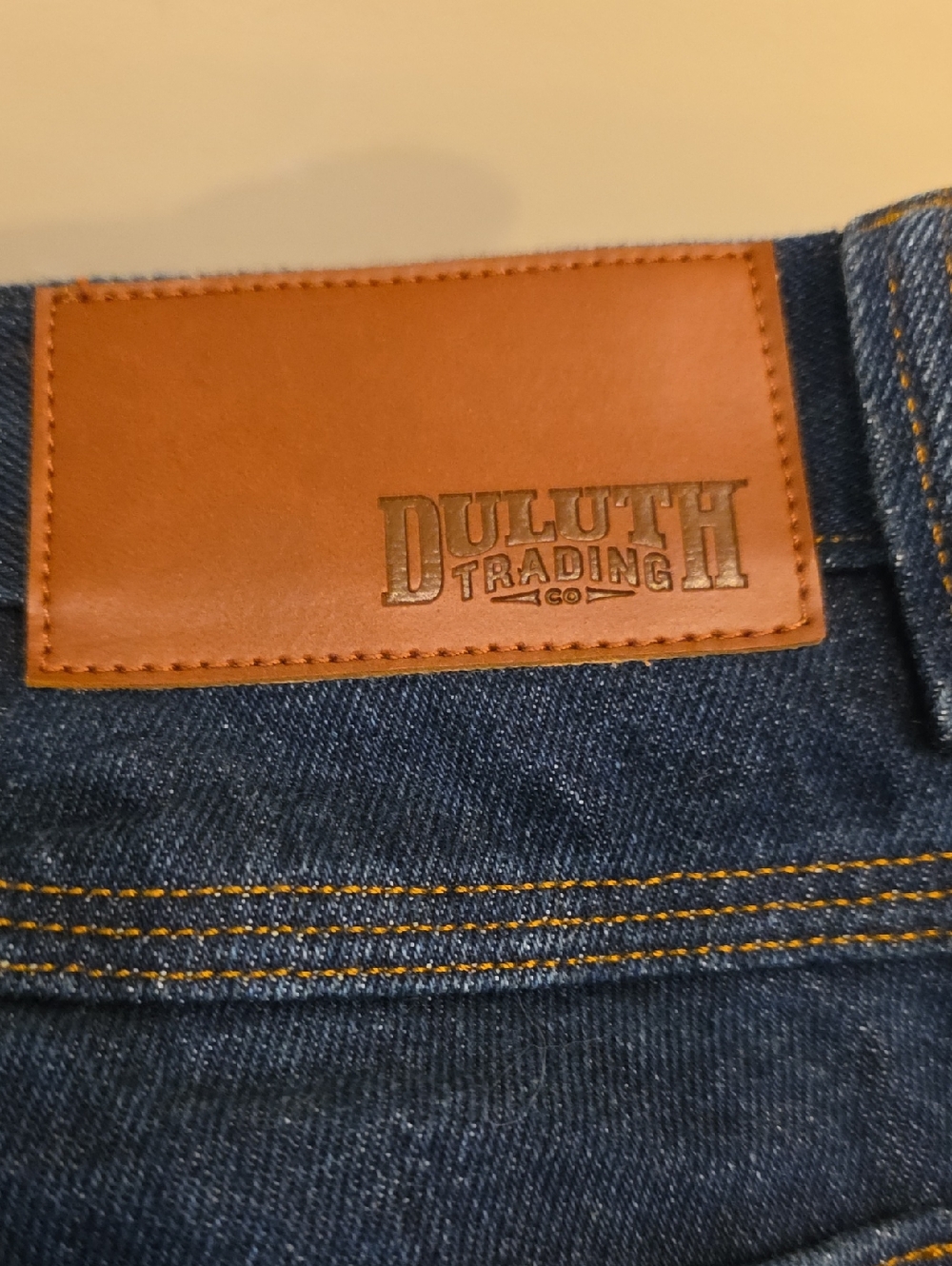 Duluth Trading Co Blue Denim Jeans with Brown Leather Patch